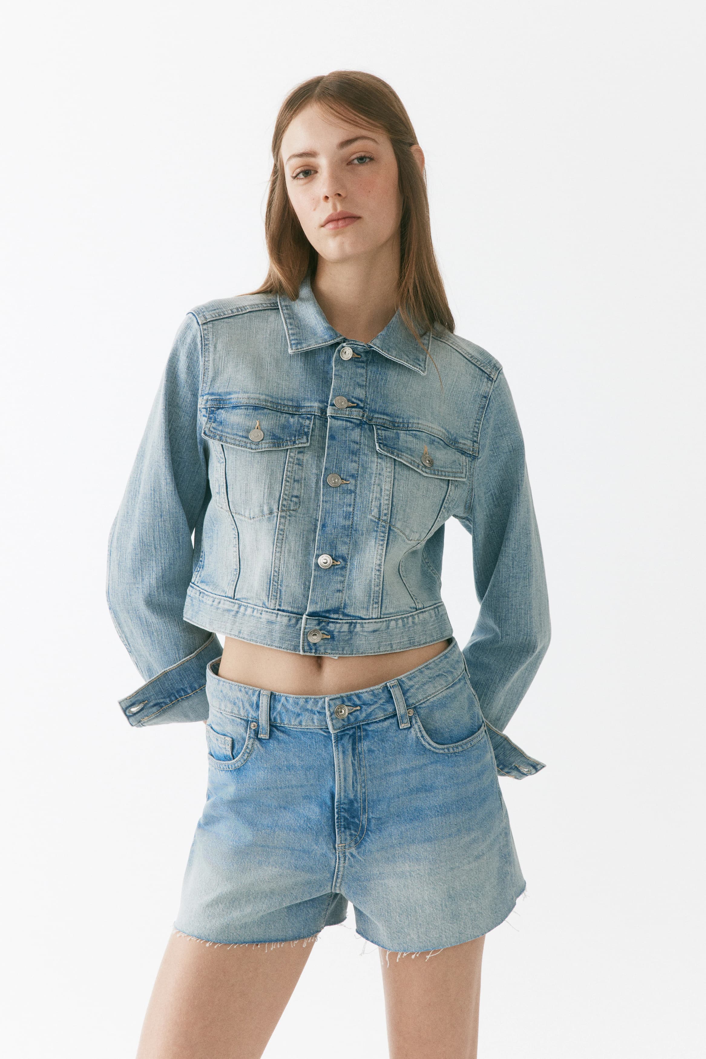 Raw-edge denim shorts