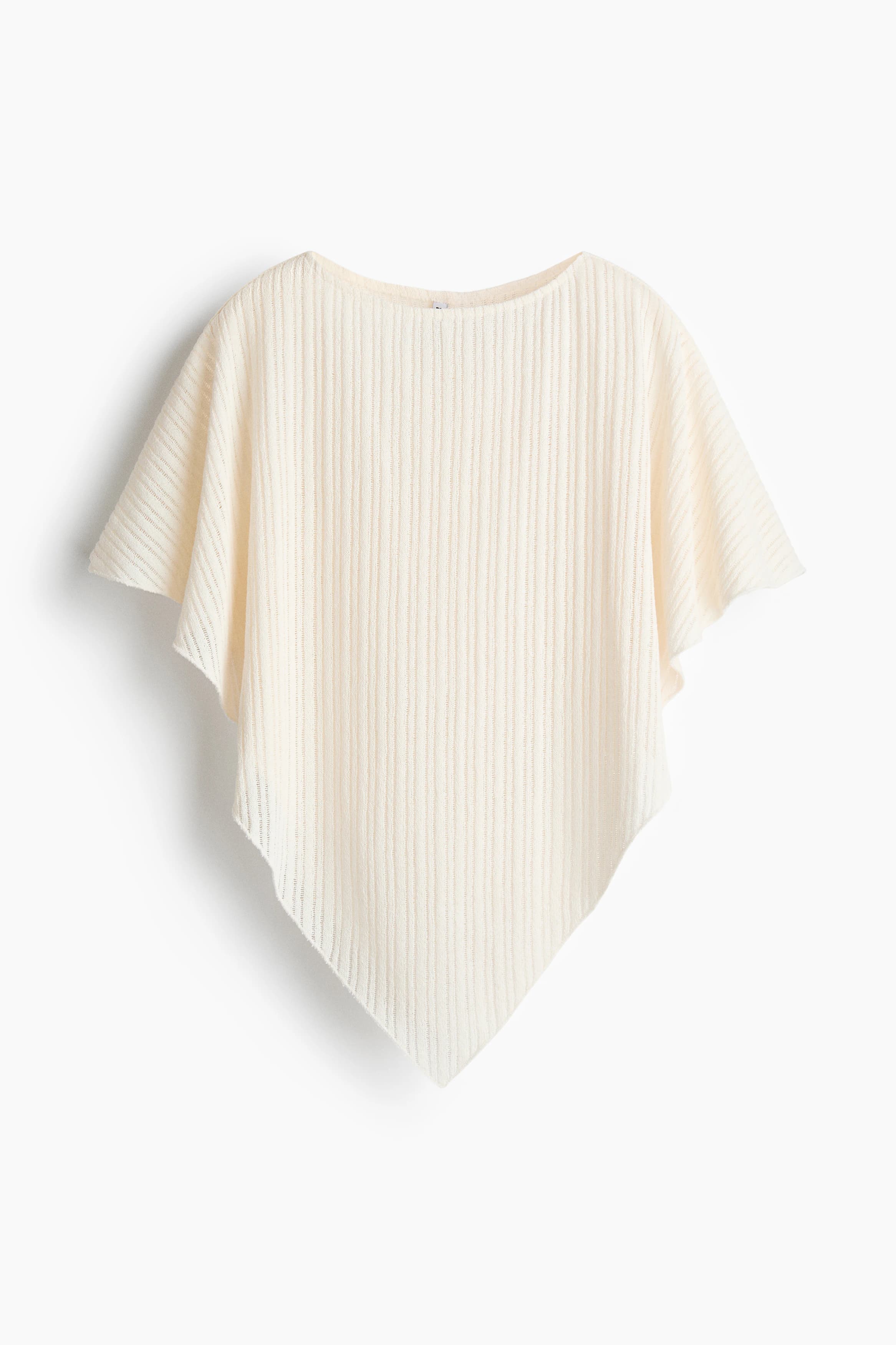 Ribgebreide poncho