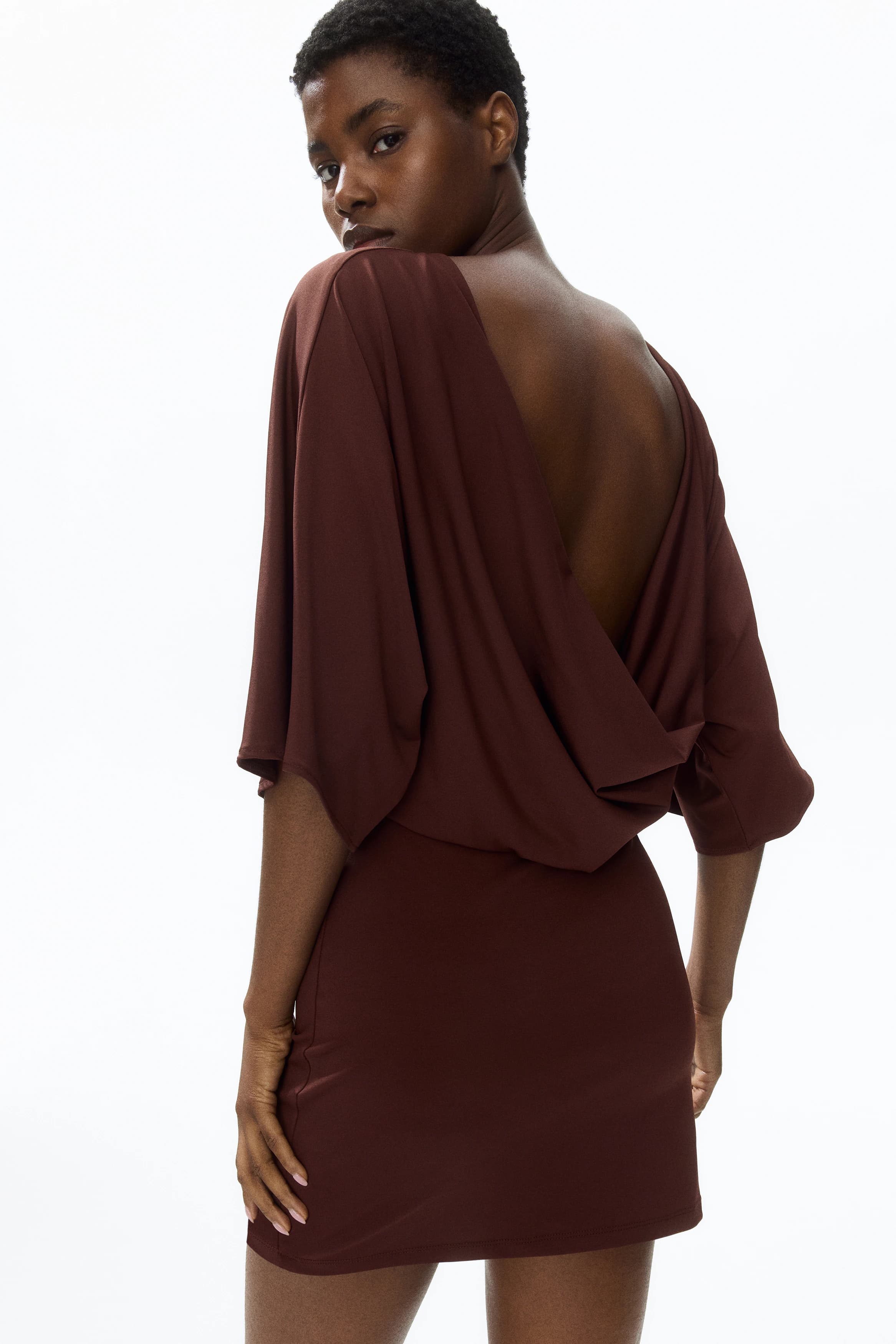 Cape-sleeved low-back dress